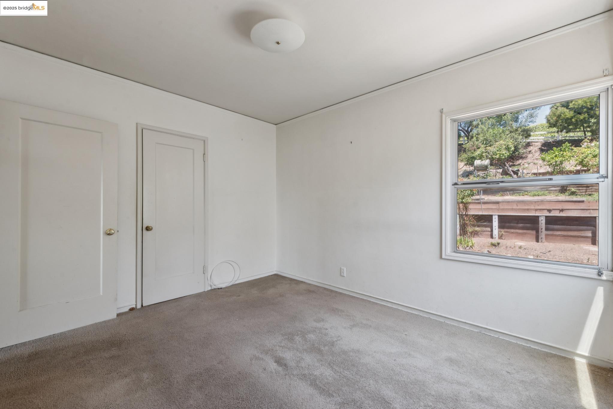 4751 Lincoln Avenue Oakland, CA 94602 - Photo 39 of 60 Spare room featuring carpet and baseboards