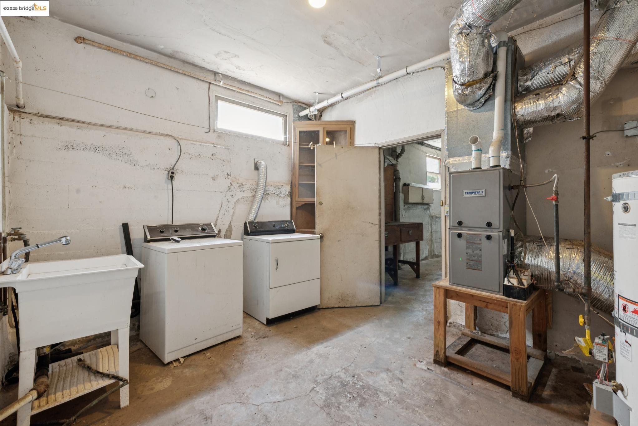 4751 Lincoln Avenue Oakland, CA 94602 - Photo 42 of 60 Below grade area featuring independent washer and dryer and secured water heater