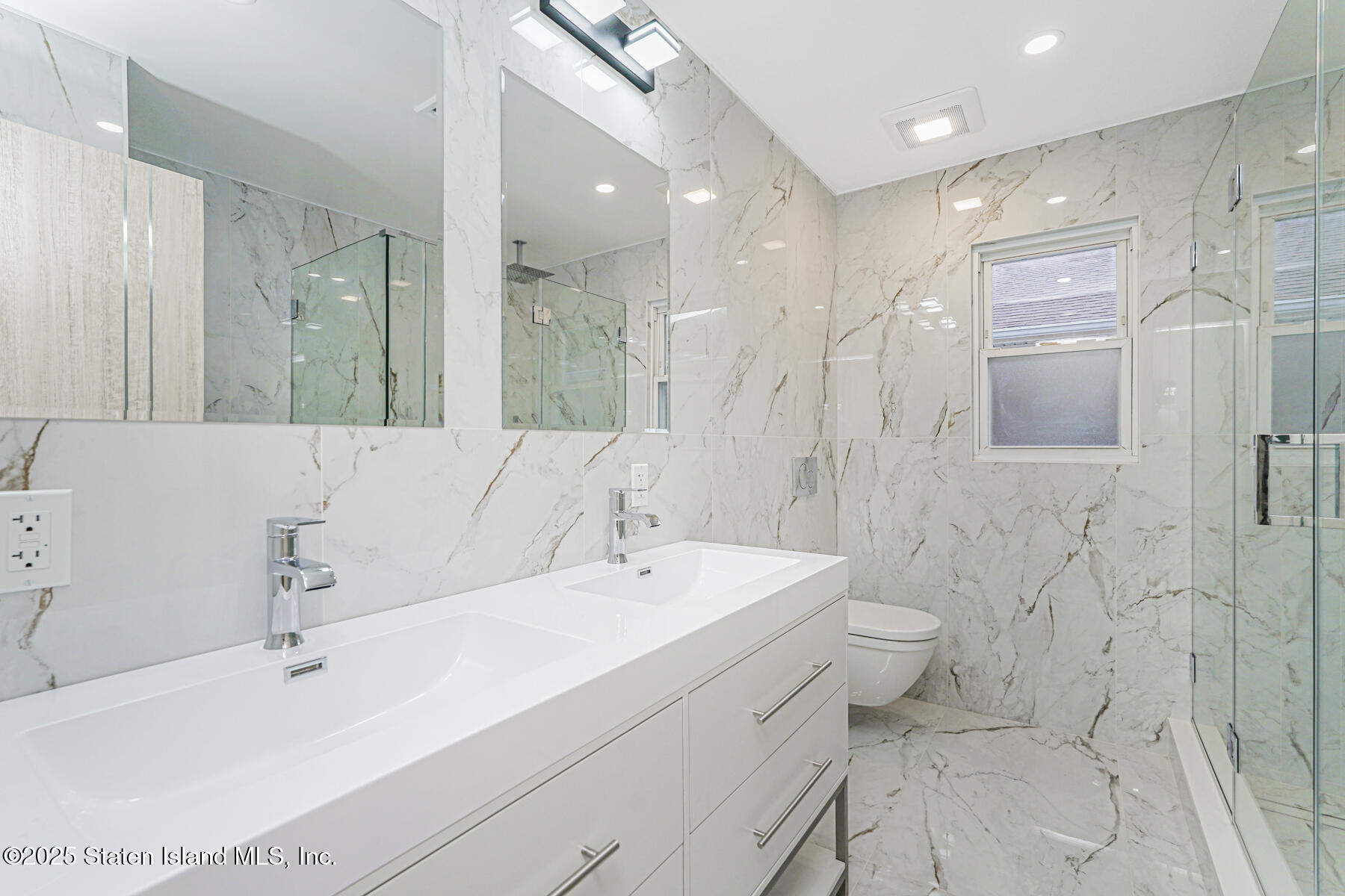 236 Amber Street Staten Island, NY 10306 - Photo 14 of 22 a bathroom with a sink a toilet and shower
