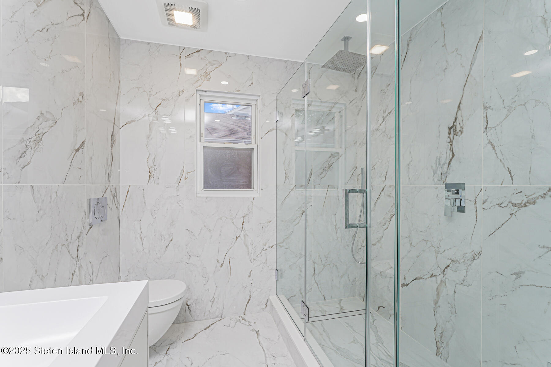 236 Amber Street Staten Island, NY 10306 - Photo 15 of 22 a bathroom with a shower and a toilet