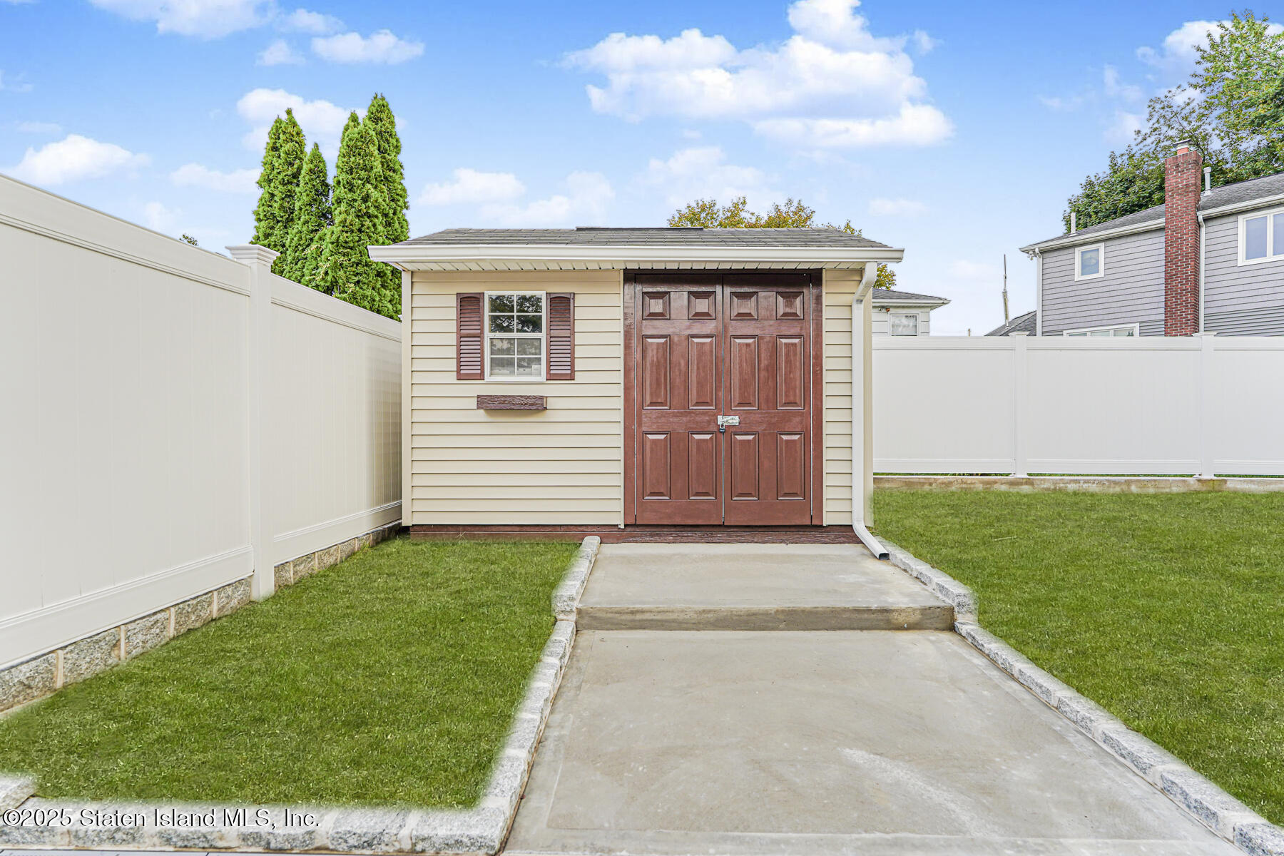 236 Amber Street Staten Island, NY 10306 - Photo 18 of 22 a front view of a house with a garden