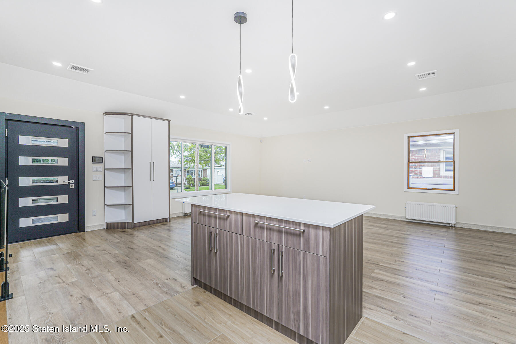 236 Amber Street Staten Island, NY 10306 - Photo 6 of 22 a view of a room with cabinets and wooden floor