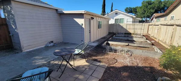 a view of a deck with wooden fence