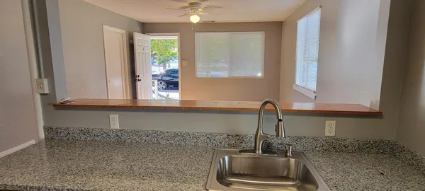 a kitchen with a sink and a window