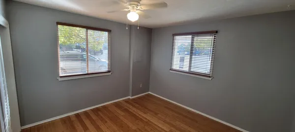 a bathroom with a white bath tub and a shower