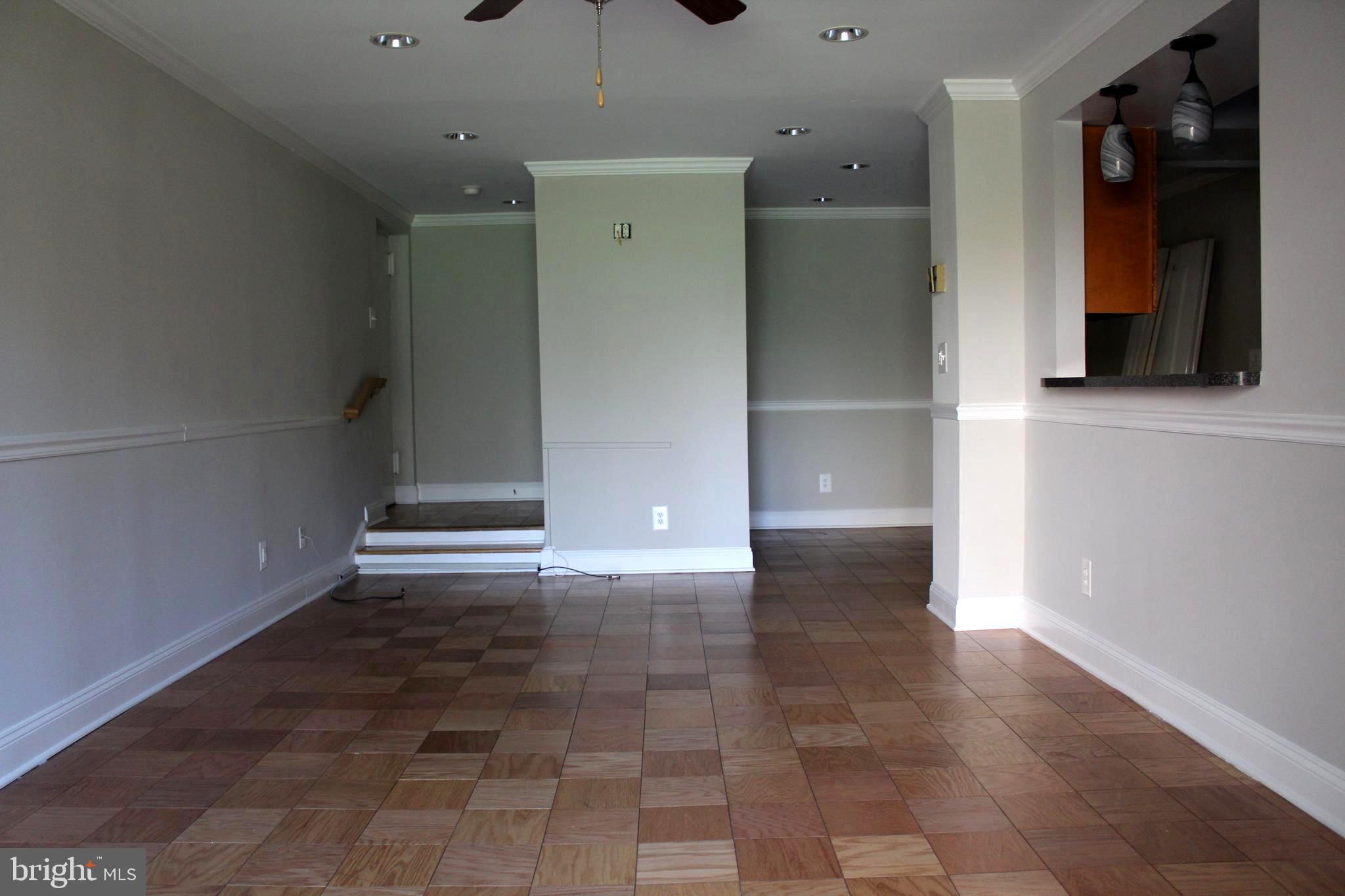 11204 Cherry Hill Road, Unit T2 Beltsville, MD 20705 - Photo 13 of 37 wooden floor in an empty room