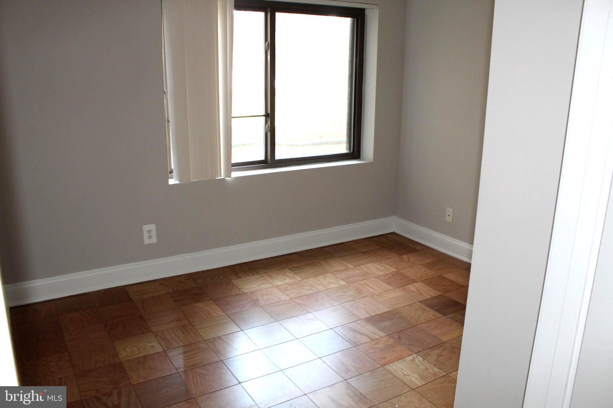 11204 Cherry Hill Road, Unit T2 Beltsville, MD 20705 - Photo 14 of 37 a view of an empty room with a window