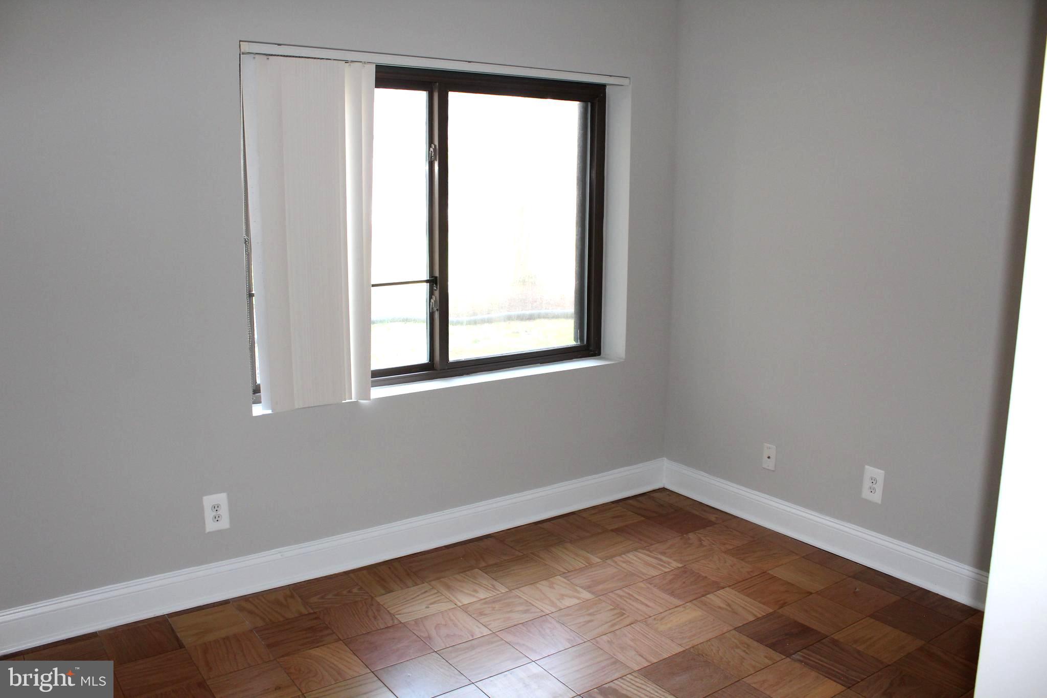 11204 Cherry Hill Road, Unit T2 Beltsville, MD 20705 - Photo 15 of 37 an empty room with a window