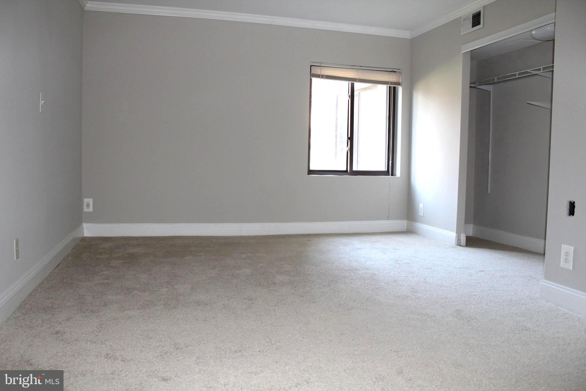 11204 Cherry Hill Road, Unit T2 Beltsville, MD 20705 - Photo 16 of 37 an empty room with a window