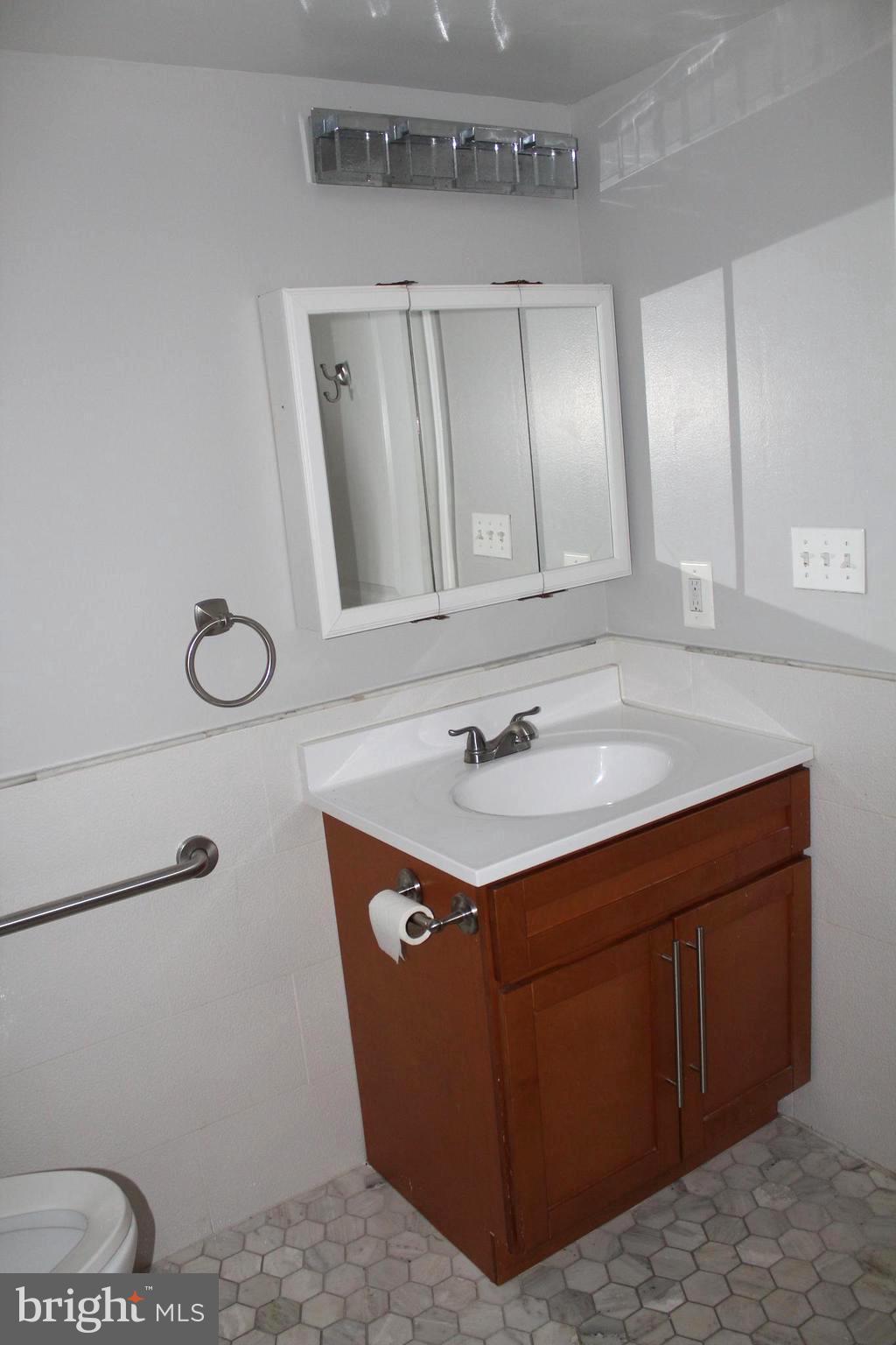 11204 Cherry Hill Road, Unit T2 Beltsville, MD 20705 - Photo 19 of 37 a sink sitting next to a bathroom sink