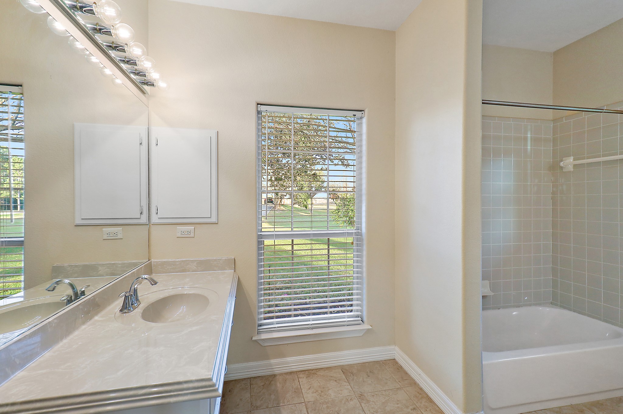4521 West Bayshore Road, Unit A Anahuac, TX 77514 - Photo 18 of 34 a bathroom with a sink and a bathtub