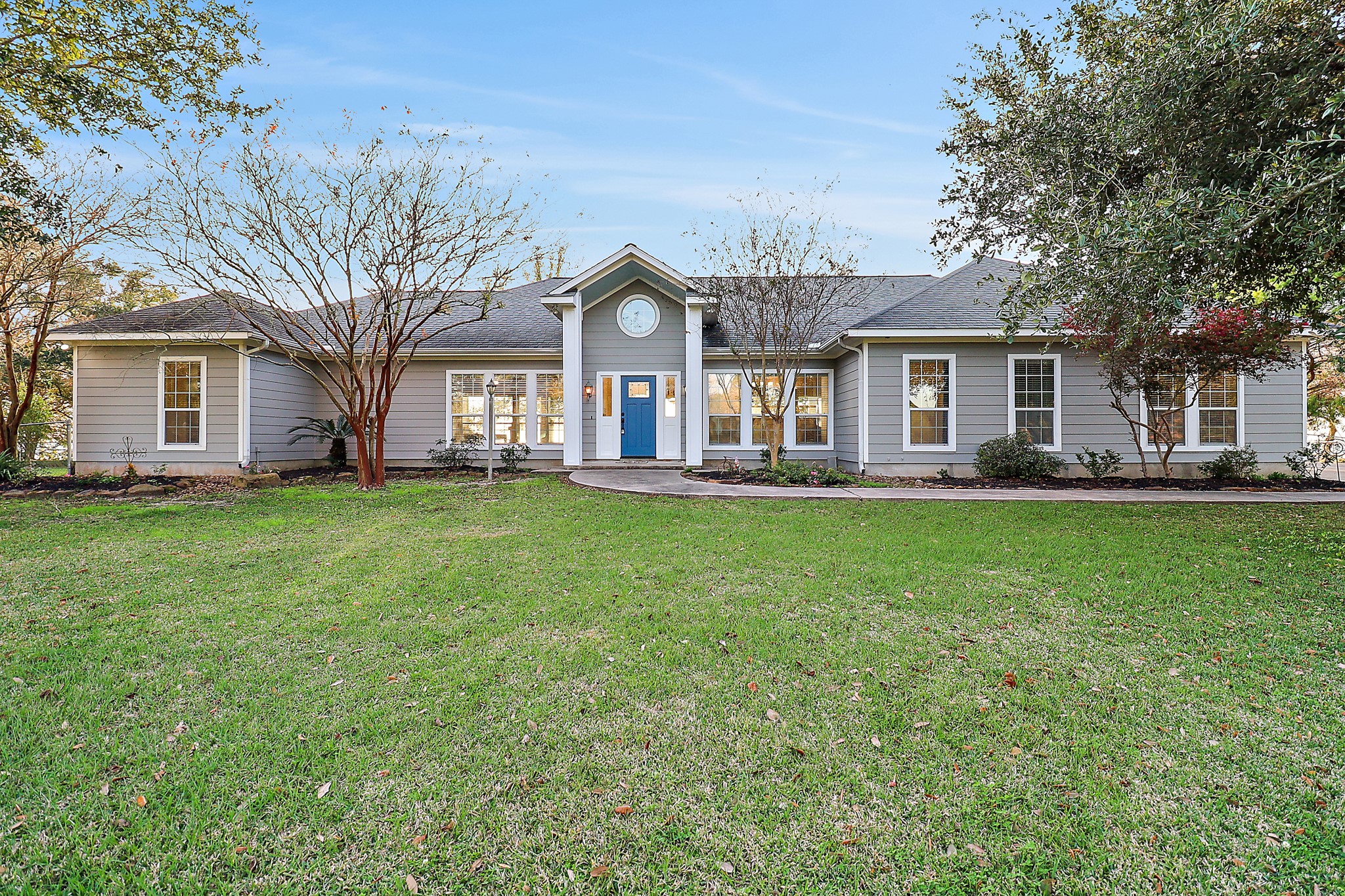 4521 West Bayshore Road, Unit A Anahuac, TX 77514 - Photo 2 of 34 a front view of house with yard and green space
