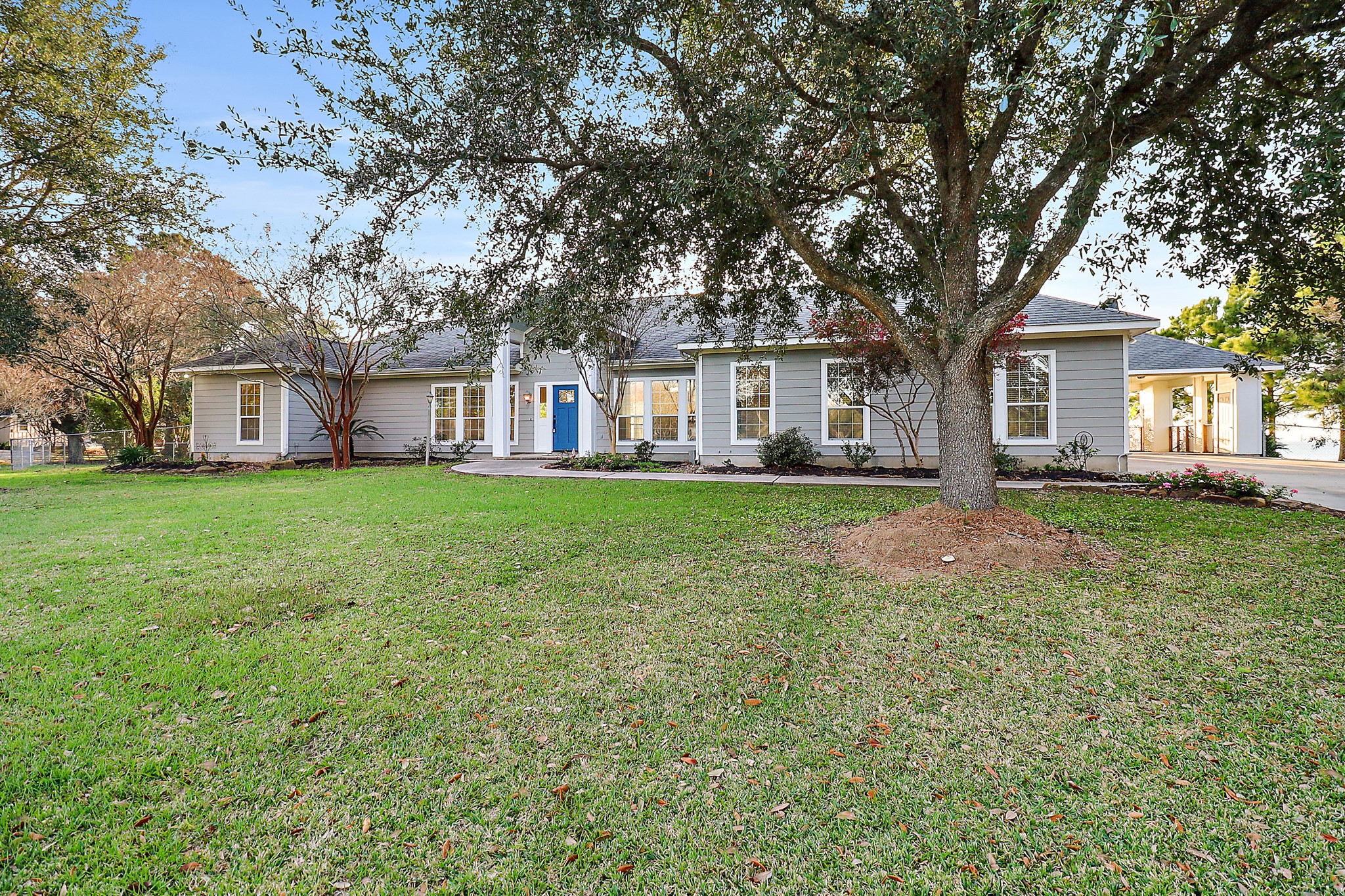 4521 West Bayshore Road, Unit A Anahuac, TX 77514 - Photo 26 of 34 front view of a house with a yard