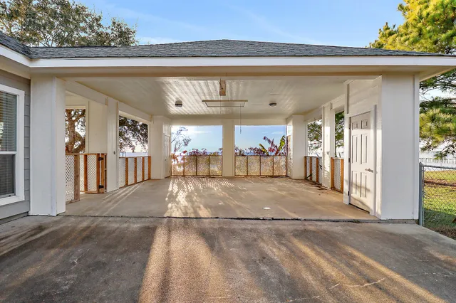 a view of a lake with couches in the house