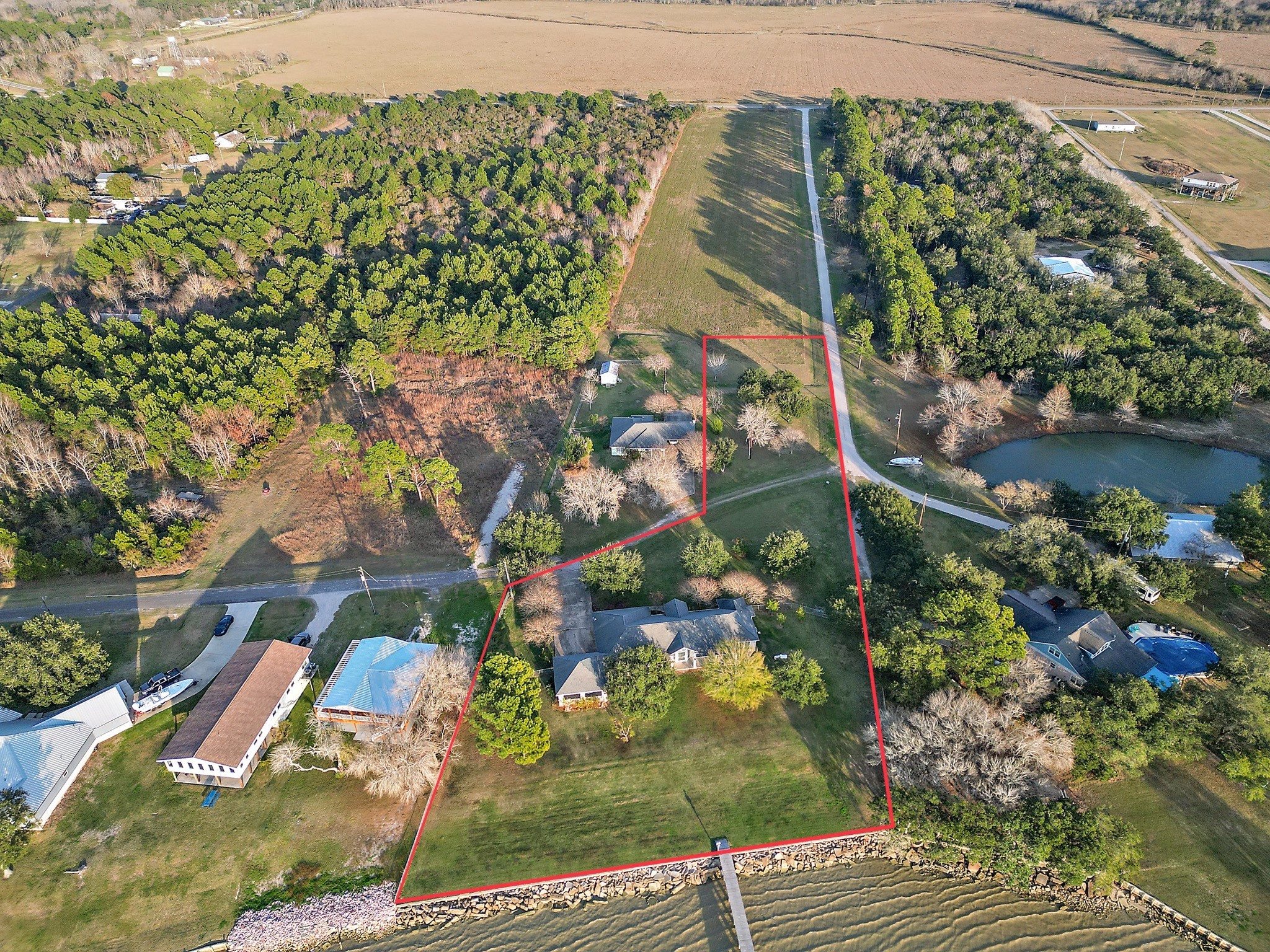 4521 West Bayshore Road, Unit A Anahuac, TX 77514 - Photo 32 of 34 a view of a lake