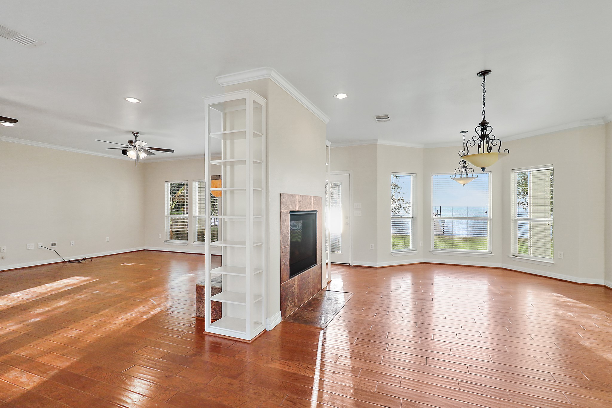 4521 West Bayshore Road, Unit A Anahuac, TX 77514 - Photo 5 of 34 a view of a room with wooden floor staircase and a kitchen