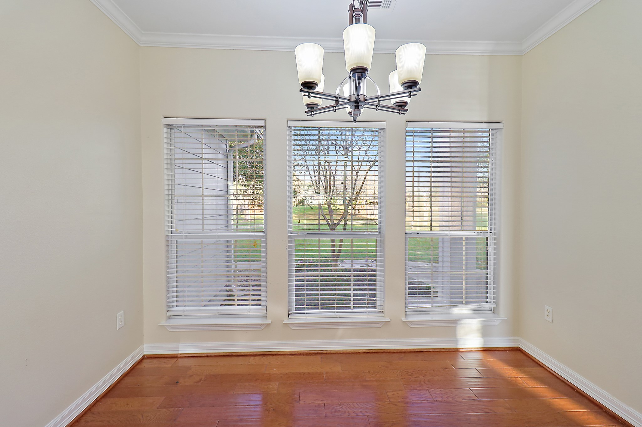 4521 West Bayshore Road, Unit A Anahuac, TX 77514 - Photo 10 of 34 a view of empty room with wooden floor and fan