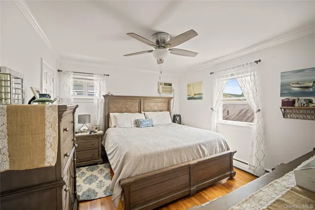 a bedroom with a bed dresser and a window