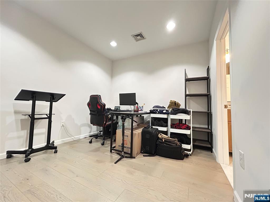 18 Independence Way, Unit J018 Edgewater, NJ 07020 - Photo 4 of 18 a view of a room with gym equipment