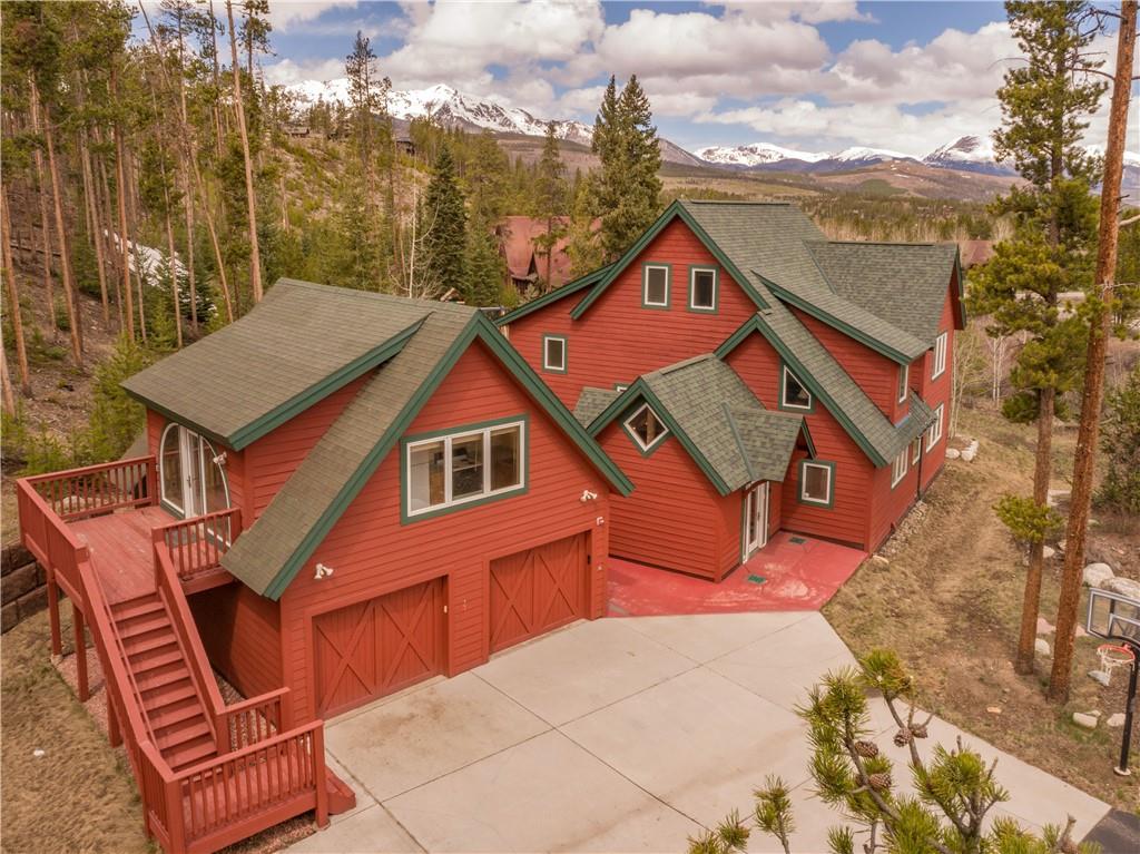 a aerial view of a house with a yard