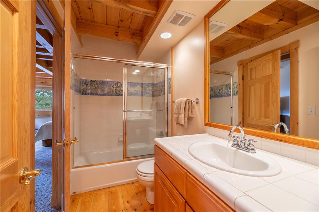 1202 Tiger Road Breckenridge, CO 80424 - Photo 14 of 35 a bathroom with a sink and a mirror