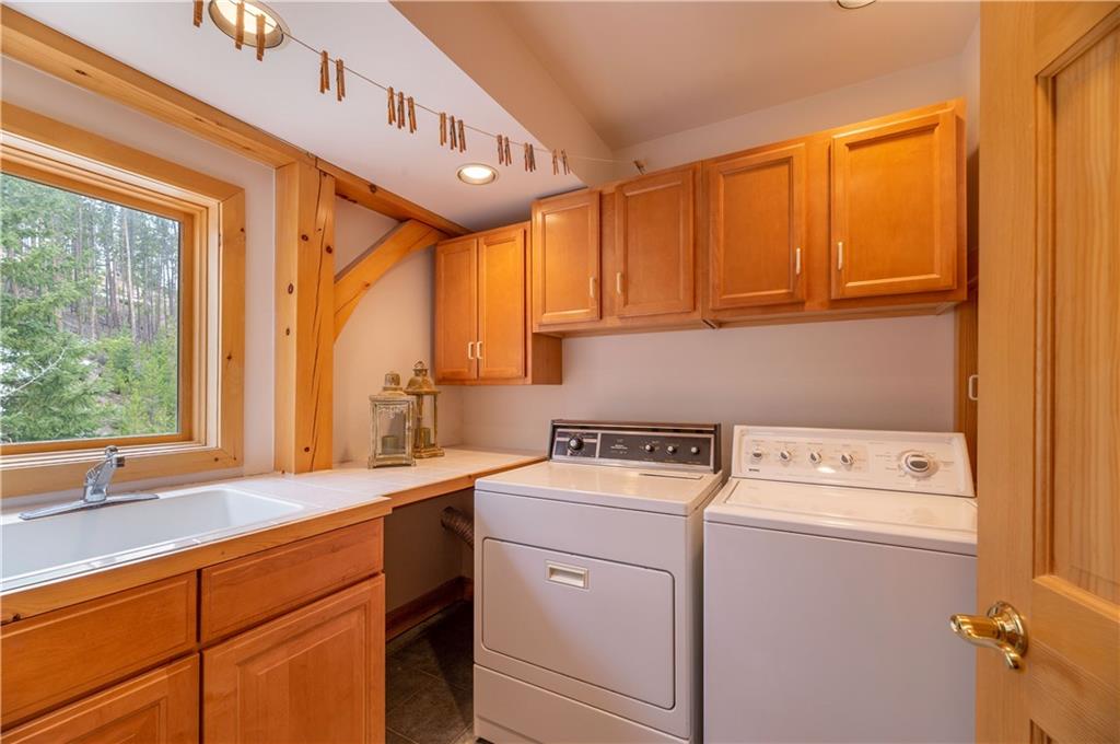 1202 Tiger Road Breckenridge, CO 80424 - Photo 15 of 35 a utility room with dryer and washer
