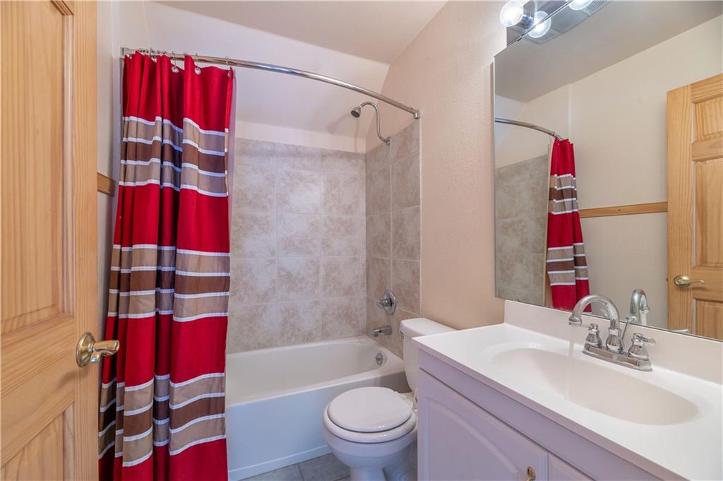 1202 Tiger Road Breckenridge, CO 80424 - Photo 30 of 35 a bathroom with a sink toilet and shower