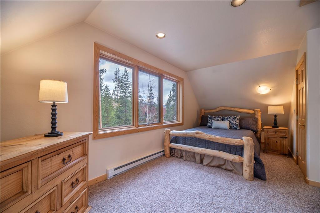 1202 Tiger Road Breckenridge, CO 80424 - Photo 32 of 35 a bedroom with a bed and a window