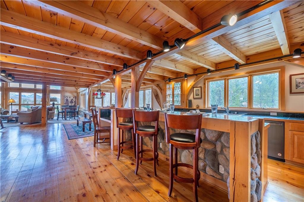 1202 Tiger Road Breckenridge, CO 80424 - Photo 5 of 35 a dining room with furniture and wooden floor
