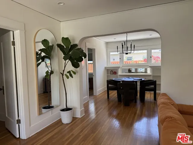 a view of dining room with furniture and wooden floor