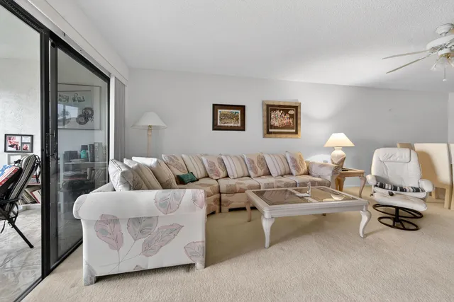 a living room with furniture and white walls