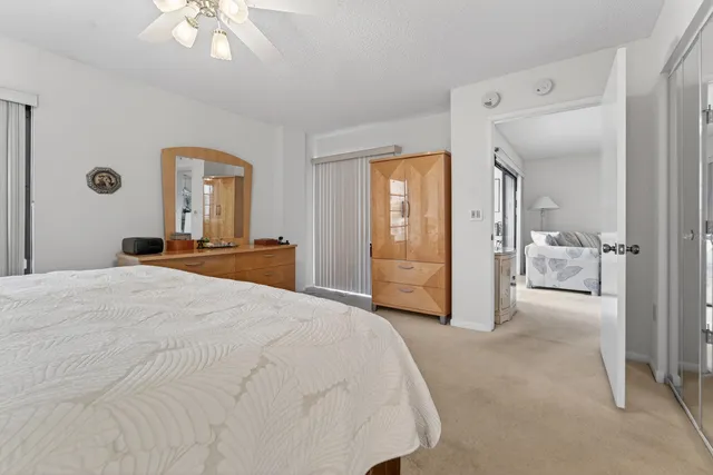 a large white bed in a white room