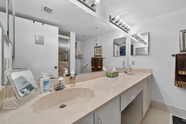 a bathroom with a shower and a tub