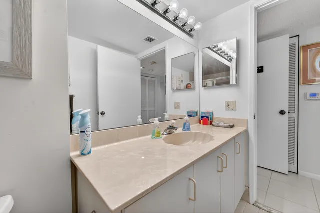 a bedroom with furniture and a chandelier