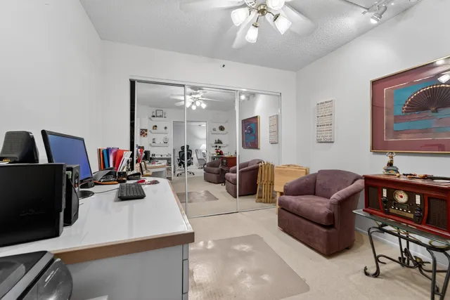 a view of a lake with houses in the back