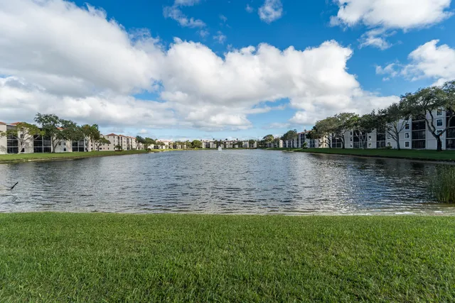 a lobby with furniture and a potted plant