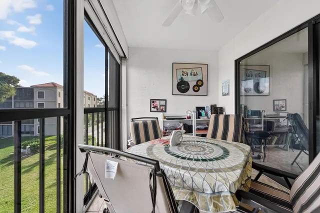 a view of a dining room with furniture window and outside view