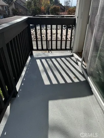 a view of a patio with chairs and a table