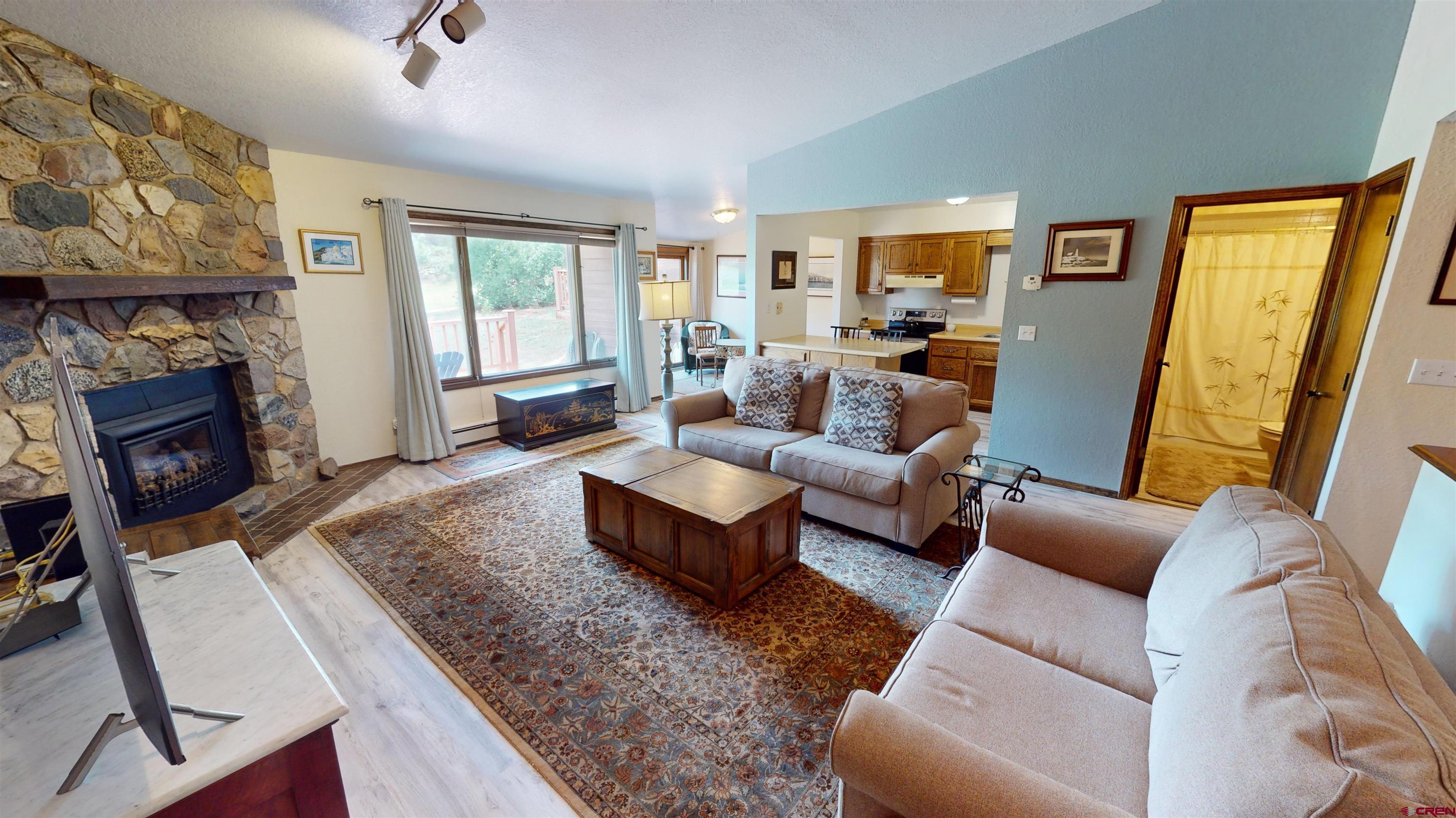 232 Pine Ridge Loop Durango, CO 81301 - Photo 1 of 35 a living room with furniture and a fireplace