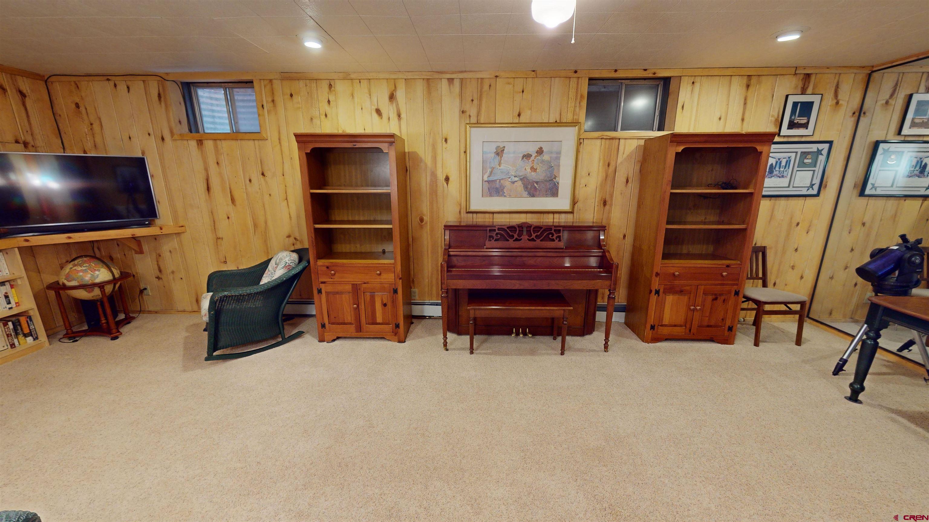 232 Pine Ridge Loop Durango, CO 81301 - Photo 23 of 35 a room with furniture and a flat screen tv