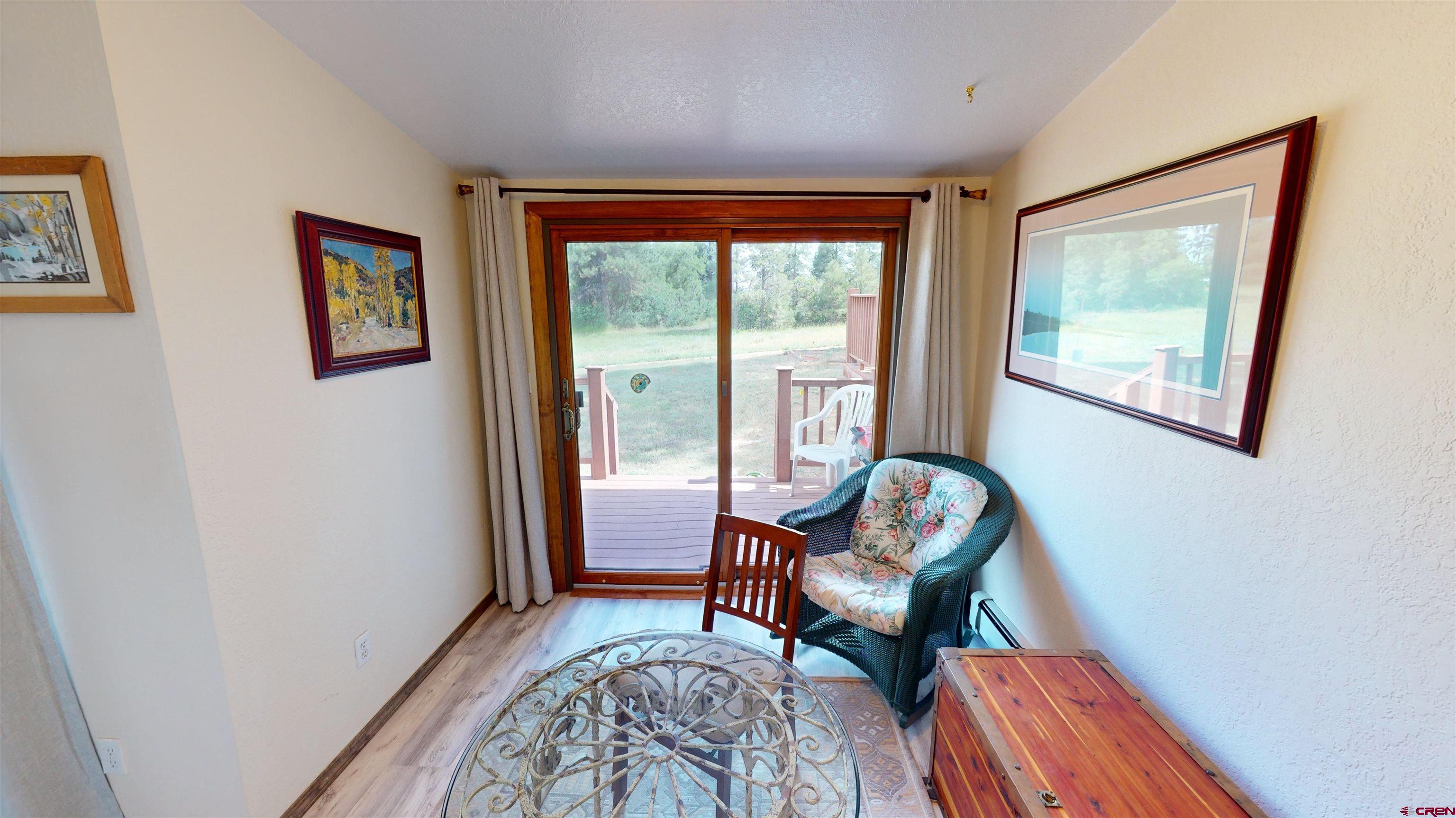 232 Pine Ridge Loop Durango, CO 81301 - Photo 34 of 35 a living room with furniture and a window