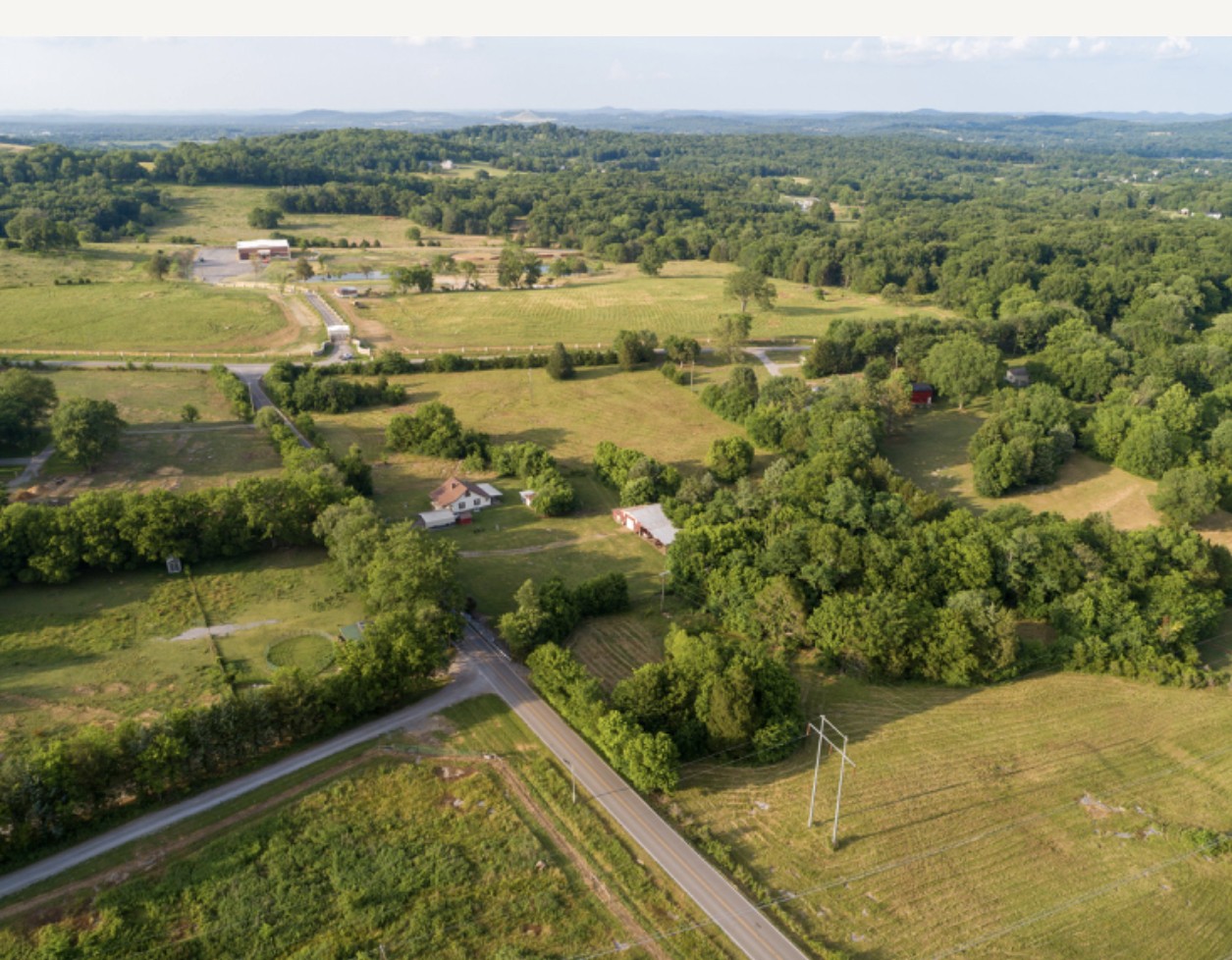 4629 Southeast Tater Peeler Road Lebanon, TN 37090 - Photo 4 of 11 a view of a lake with a yard