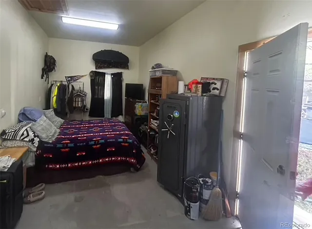 a bedroom with a bed and a walk in closet