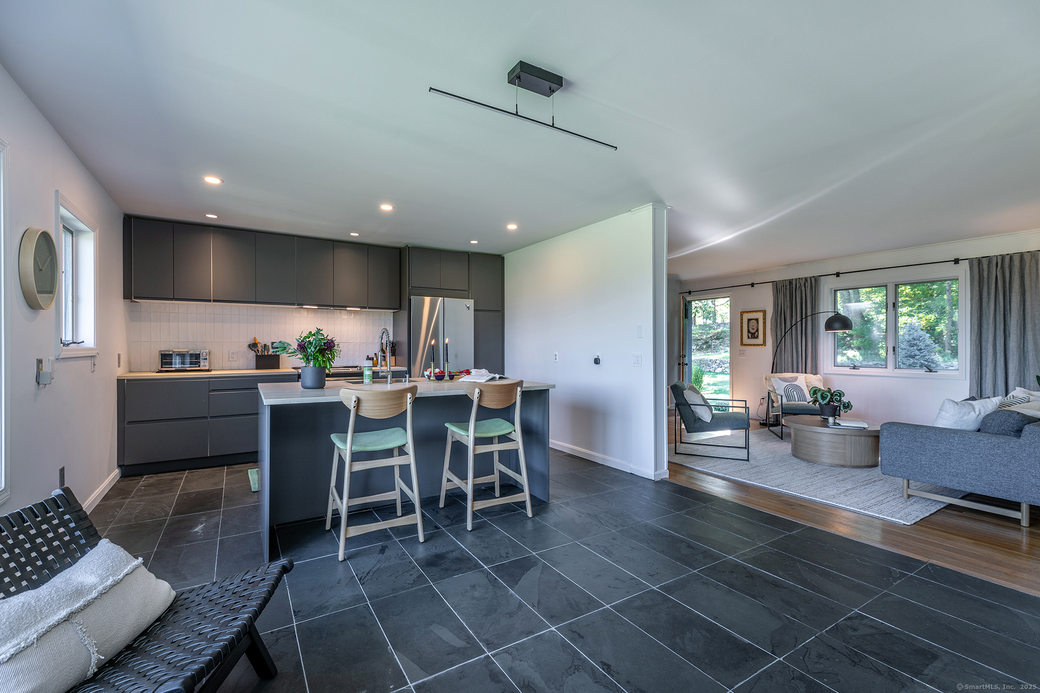 10 Surdan Mountain Road Sharon, CT 06069 - Photo 11 of 31 a kitchen with a dining table chairs and view kitchen