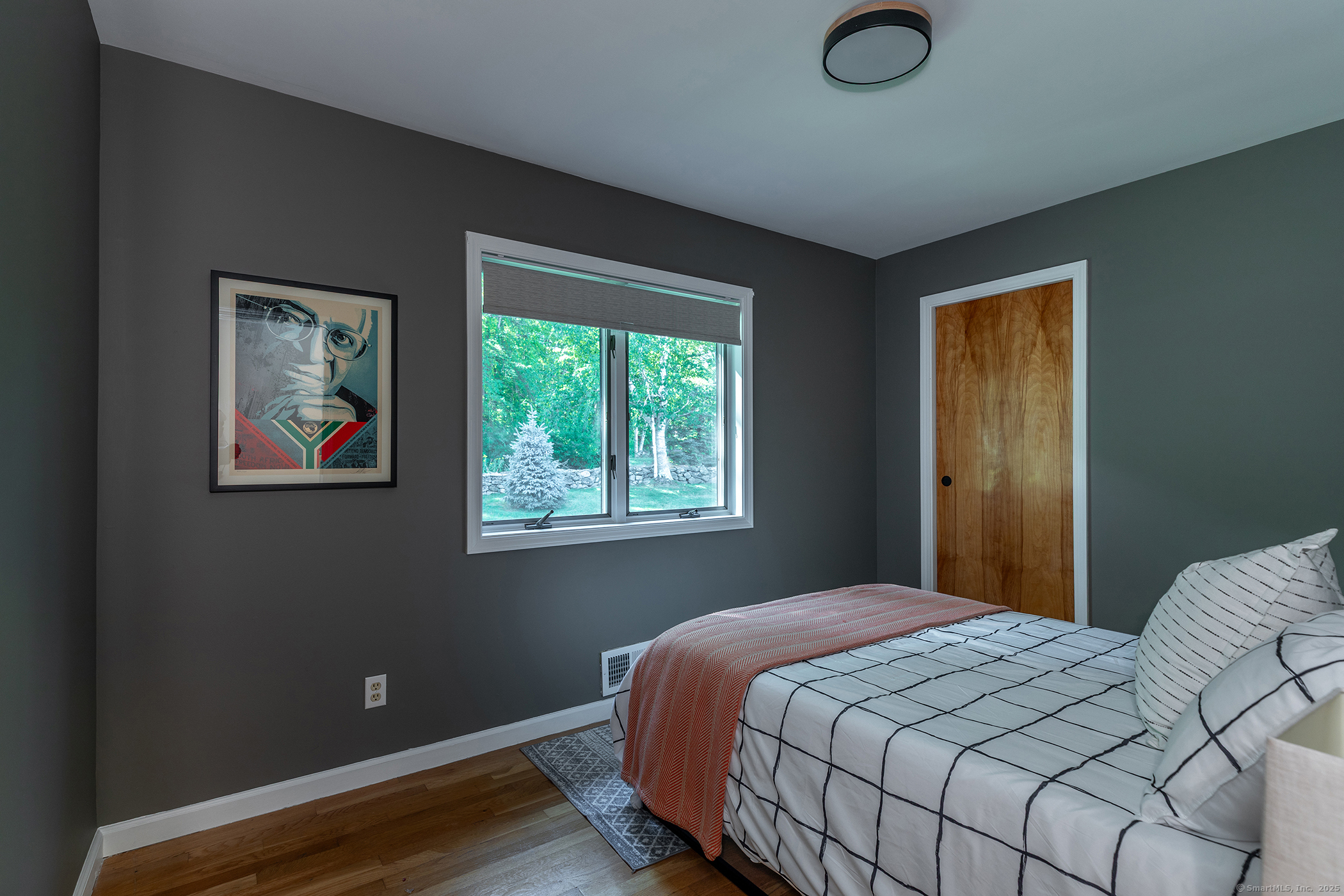 10 Surdan Mountain Road Sharon, CT 06069 - Photo 17 of 31 a bedroom with a bed and a window