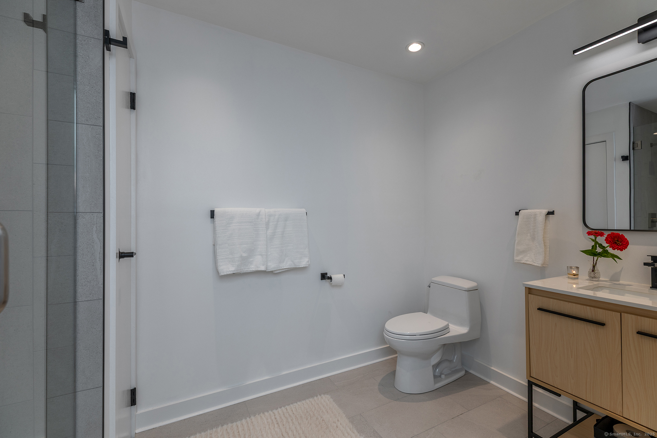 10 Surdan Mountain Road Sharon, CT 06069 - Photo 19 of 31 a white toilet sitting next to a bathroom sink