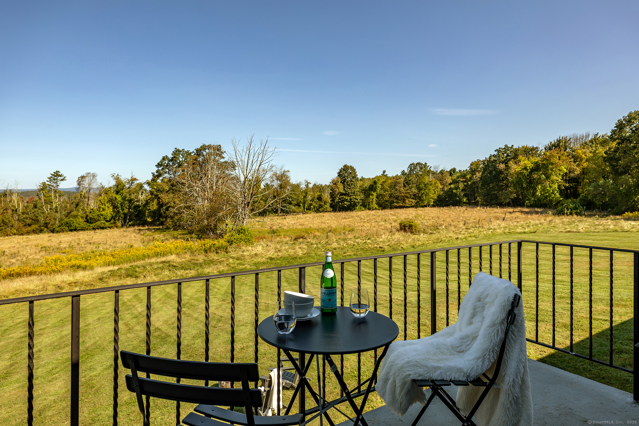 10 Surdan Mountain Road Sharon, CT 06069 - Photo 21 of 31 a view of a chair and table on the balcony