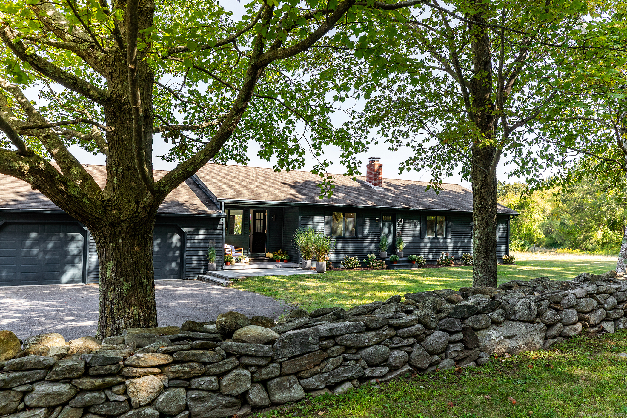 10 Surdan Mountain Road Sharon, CT 06069 - Photo 28 of 31 a front view of a house with a yard