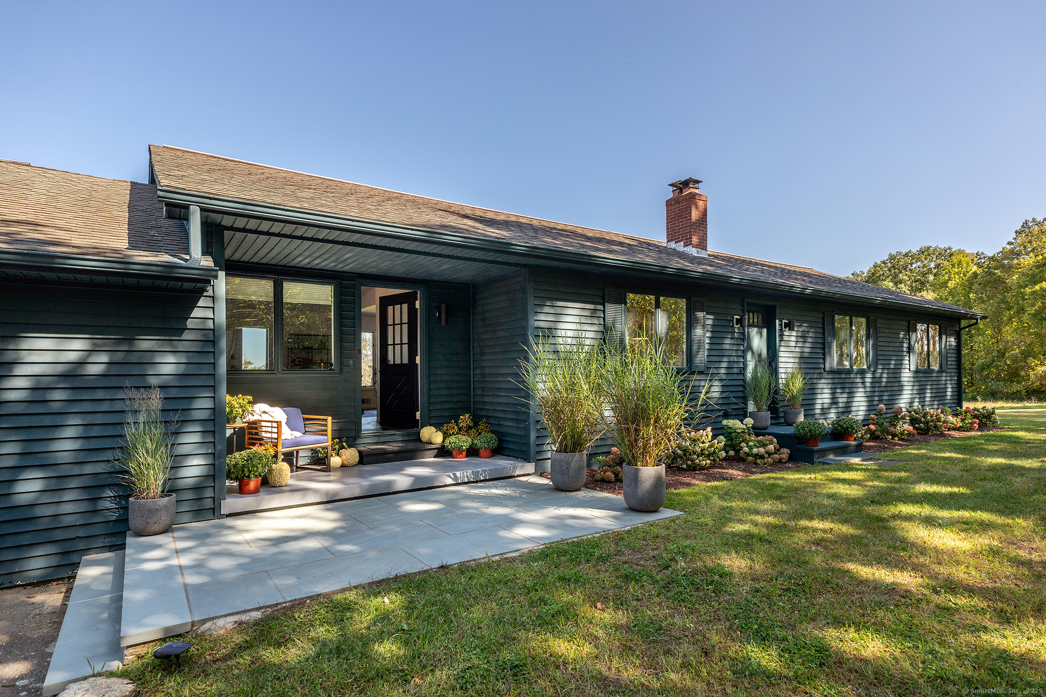 10 Surdan Mountain Road Sharon, CT 06069 - Photo 31 of 31 a view of a house with sitting area and garden