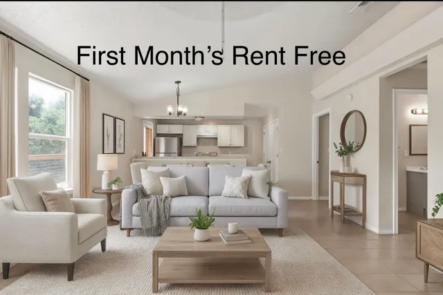 a living room with furniture and a table